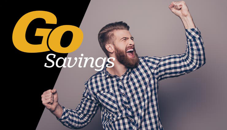 Go Savings: Young, bearded man pumps his fists in excitement.